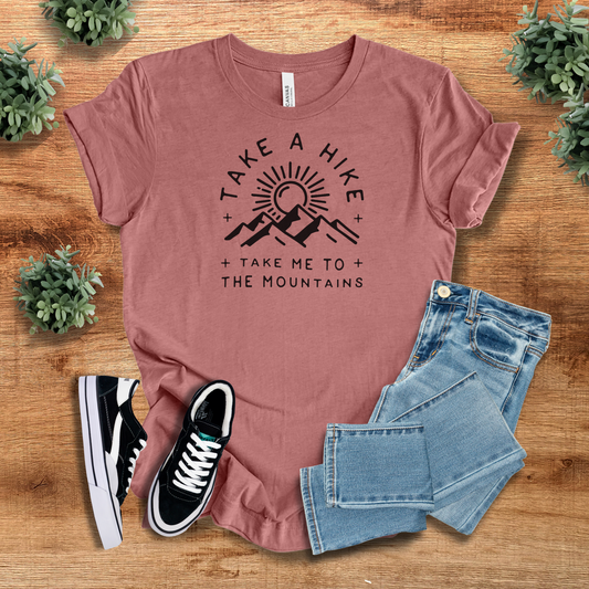 Mauve Take a Hike Graphic Tee with a minimalist mountain design. A stylish and comfy choice for nature lovers and hikers.