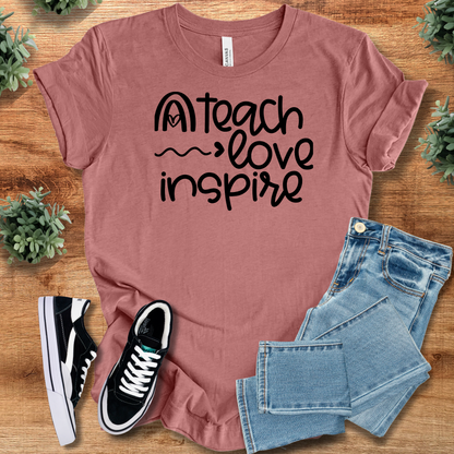 Heather-aqua t-shirt with '' text, flat lay styled on a wooden surface.