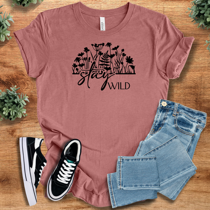 Soft-cream t-shirt with '' text, flat lay styled on a wooden surface.