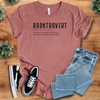 Heather-navy t-shirt with '' text, flat lay styled on a wooden surface.