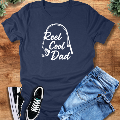 Military-green t-shirt with '' text, flat lay styled on a wooden surface.