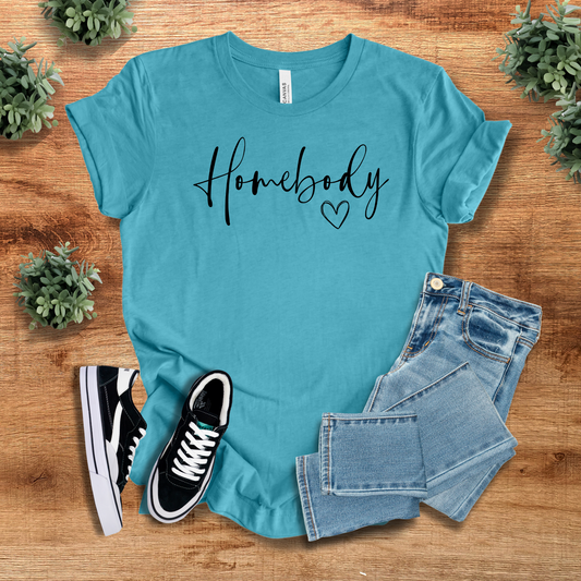 Teal Homebody Graphic T-Shirt with a cute script design, styled with jeans and sneakers. A trendy and comfortable tee for lounging in style.
