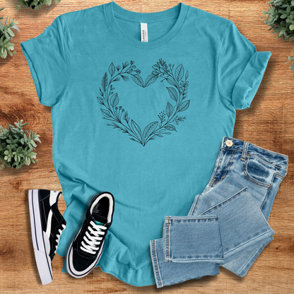 Soft-cream t-shirt with '' text, flat lay styled on a wooden surface.