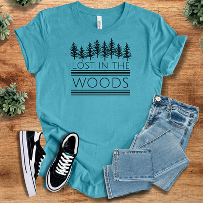 Heather-navy t-shirt with '' text, flat lay styled on a wooden surface.