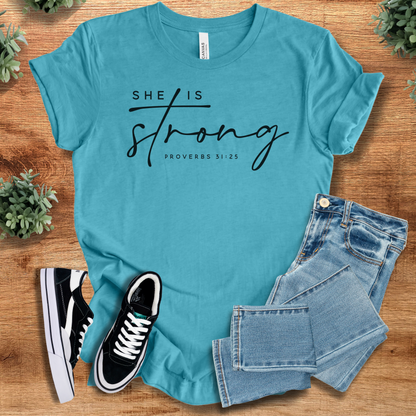 Heather-navy t-shirt with '' text, flat lay styled on a wooden surface.