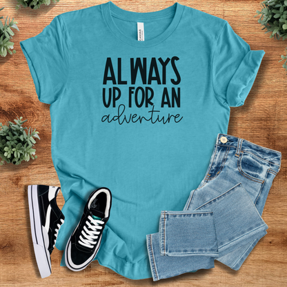 Heather-mauve t-shirt with '' text, flat lay styled on a wooden surface.
