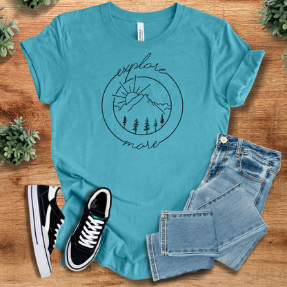 Heather-mauve t-shirt with '' text, flat lay styled on a wooden surface.