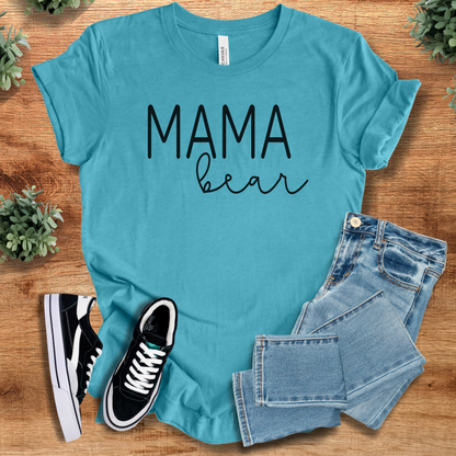 Heather-navy t-shirt with '' text, flat lay styled on a wooden surface.