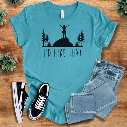 Heather-mauve t-shirt with '' text, flat lay styled on a wooden surface.