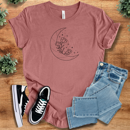 Heather-navy t-shirt with '' text, flat lay styled on a wooden surface.