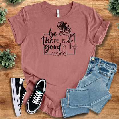Soft-cream t-shirt with '' text, flat lay styled on a wooden surface.