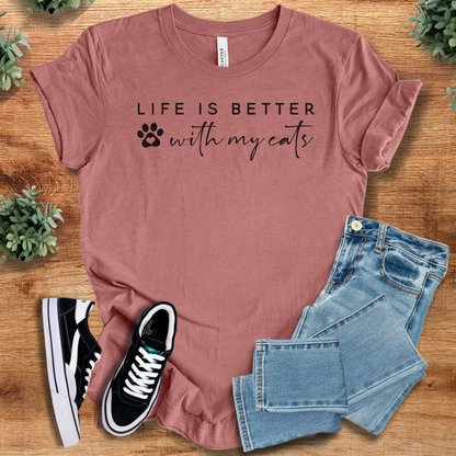 Heather-aqua t-shirt with '' text, flat lay styled on a wooden surface.