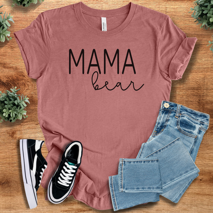 Heather-navy t-shirt with '' text, flat lay styled on a wooden surface.