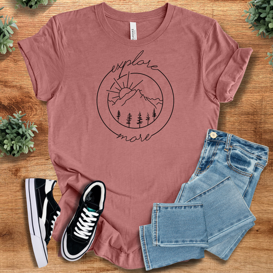 Explore More Nature T‑Shirt in mauve on soft Bella+Canvas 3001 fabric with minimalist mountain and forest graphic. Unisex comfy tee for outdoor lovers.