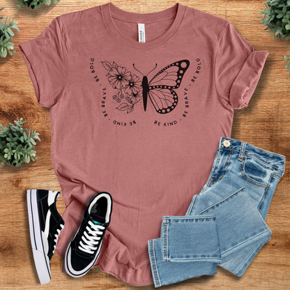 Soft-cream t-shirt with '' text, flat lay styled on a wooden surface.