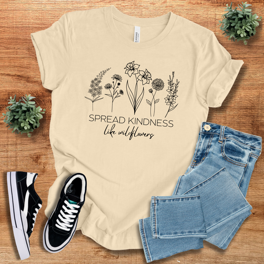 Cream Spread Kindness Like Wildflowers T-Shirt featuring a minimalist floral print. Sustainable and comfortable unisex cotton tee for casual wear.
