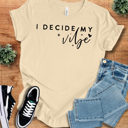 Heather-mauve t-shirt with '' text, flat lay styled on a wooden surface.