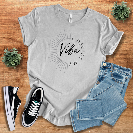 Light gray 'I Decide My Vibe' classic unisex short sleeve tee with a minimalist sunburst graphic. A versatile and comfortable fashion staple.