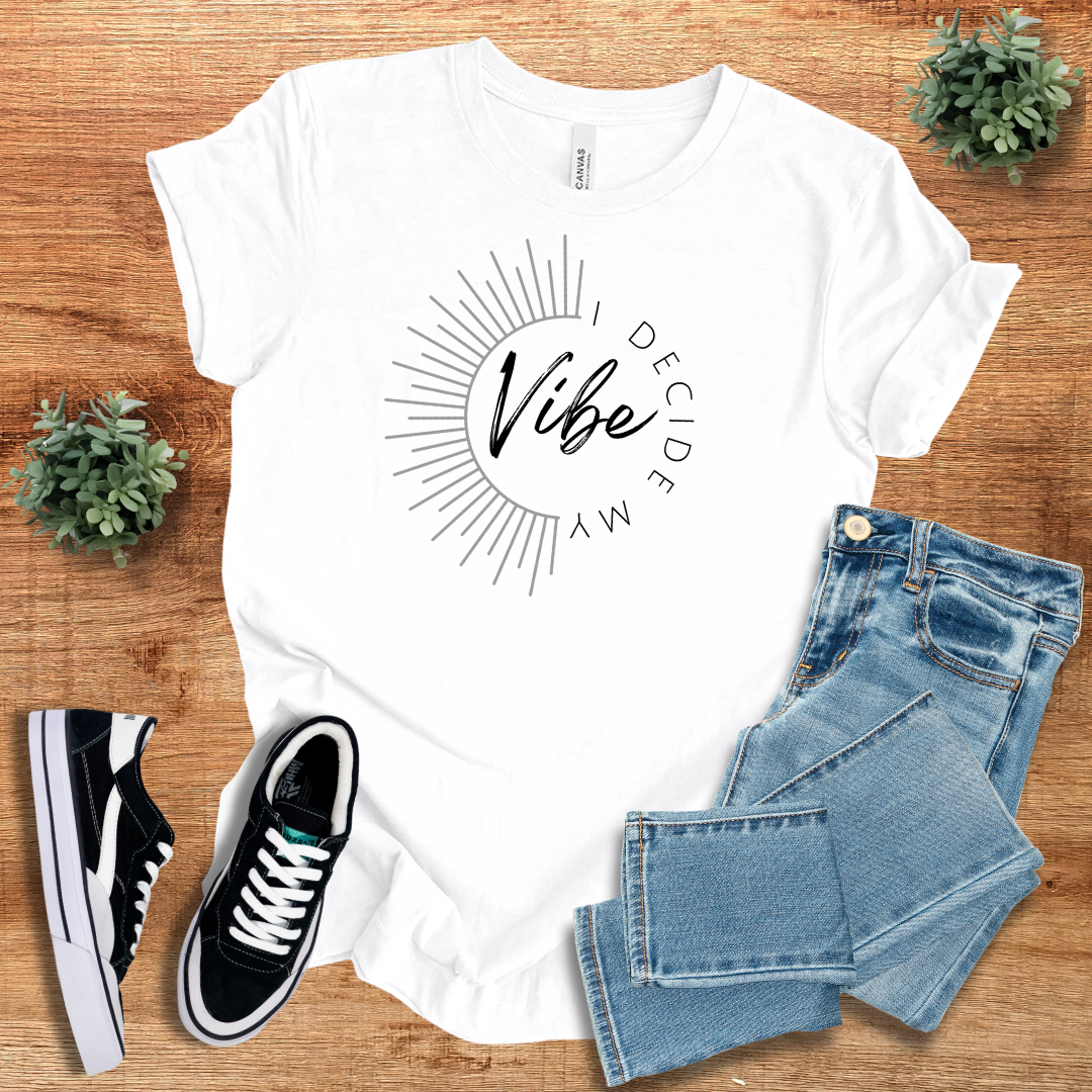 White 'I Decide My Vibe' classic unisex short sleeve tee with a stylish sunburst design. Soft cotton fabric, perfect for casual wear.