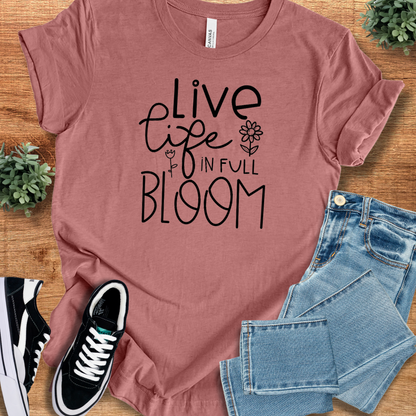 Heather-aqua t-shirt with '' text, flat lay styled on a wooden surface.