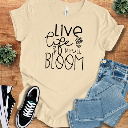 Heather-aqua t-shirt with '' text, flat lay styled on a wooden surface.