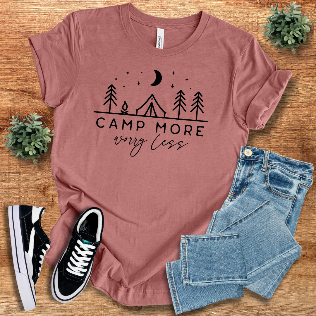 Dusty rose 'Camp More Worry Less' t-shirt with a cozy camping-themed print. A soft and stylish crew neck tee for outdoor enthusiasts and travelers.