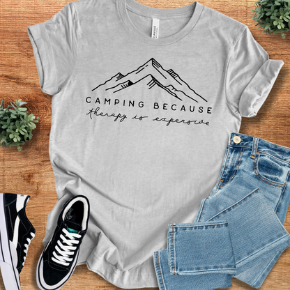 Athletic-heather t-shirt with '' text, flat lay styled on a wooden surface.