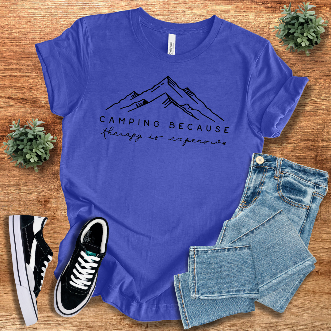 Royal blue 'Camping Because Therapy is so Expensive' t-shirt with mountain print. Comfortable cotton crew neck tee for hiking and outdoor fun.