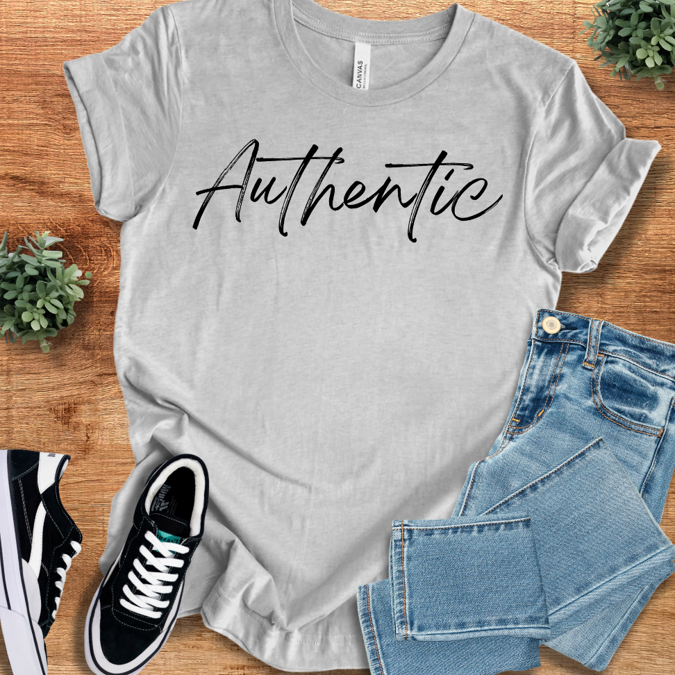 Light gray Authentic Tshirt Classic Unisex Short Sleeve Tee with black script text. Classic crew neck design for comfortable everyday wear.