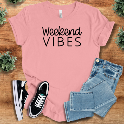 Heather-aqua t-shirt with '' text, flat lay styled on a wooden surface.