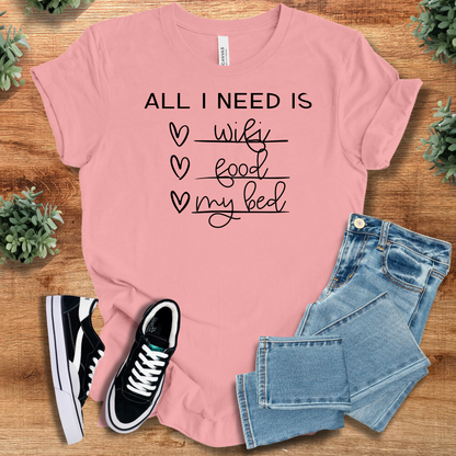 Heather-aqua t-shirt with '' text, flat lay styled on a wooden surface.