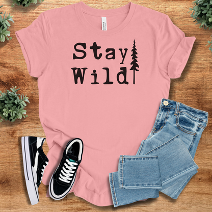 Heather-navy t-shirt with '' text, flat lay styled on a wooden surface.