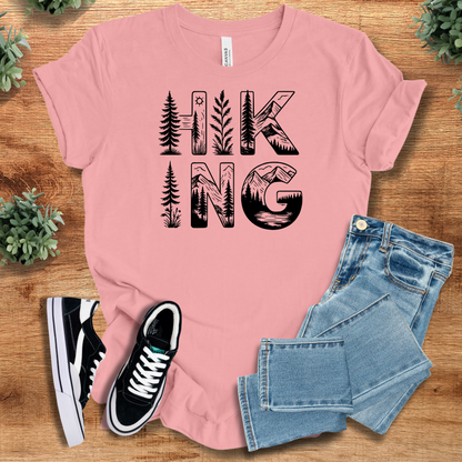 Yellow t-shirt with '' text, flat lay styled on a wooden surface.