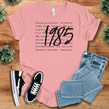 Athletic-heather t-shirt with '' text, flat lay styled on a wooden surface.