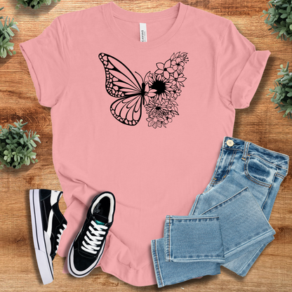 Military-green t-shirt with '' text, flat lay styled on a wooden surface.