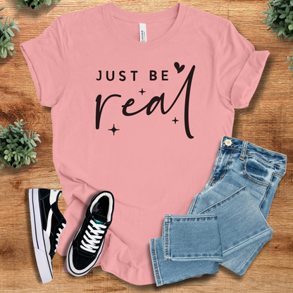 Heather-aqua t-shirt with '' text, flat lay styled on a wooden surface.