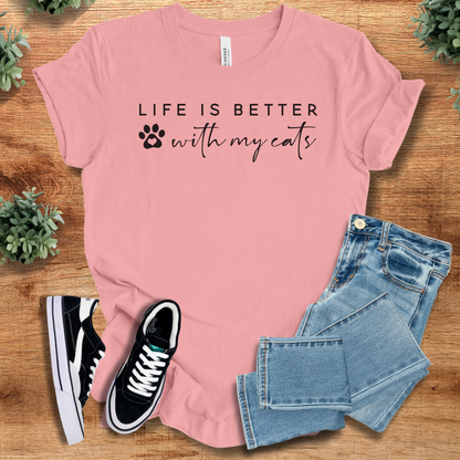 Heather-aqua t-shirt with '' text, flat lay styled on a wooden surface.