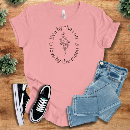 Athletic-heather t-shirt with '' text, flat lay styled on a wooden surface.