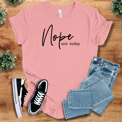 Heather-aqua t-shirt with '' text, flat lay styled on a wooden surface.