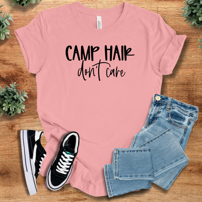 Heather-aqua t-shirt with '' text, flat lay styled on a wooden surface.