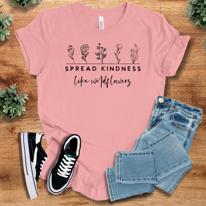 Heather-aqua t-shirt with '' text, flat lay styled on a wooden surface.