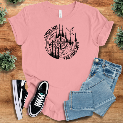 Heather-aqua t-shirt with '' text, flat lay styled on a wooden surface.