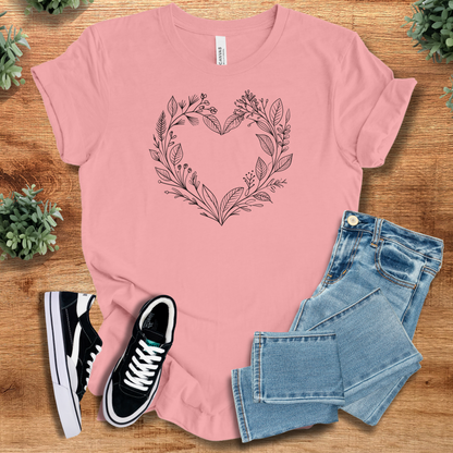 Athletic-heather t-shirt with '' text, flat lay styled on a wooden surface.