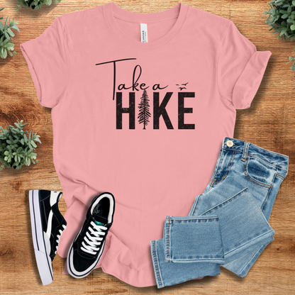 Heather-aqua t-shirt with '' text, flat lay styled on a wooden surface.