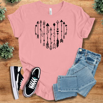 Heather-mauve t-shirt with '' text, flat lay styled on a wooden surface.
