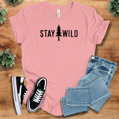 Heather-navy t-shirt with '' text, flat lay styled on a wooden surface.