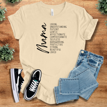 Soft-cream t-shirt with 'Mama Inspirational T‑Shirt' text, flat lay styled on a wooden surface.