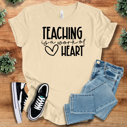 Athletic-heather t-shirt with '' text, flat lay styled on a wooden surface.