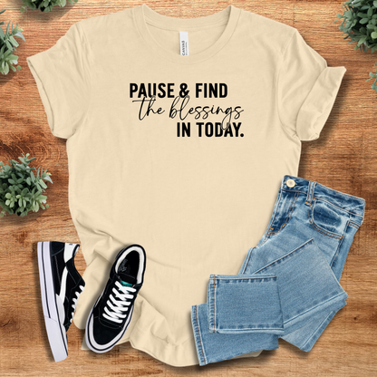 Athletic-heather t-shirt with '' text, flat lay styled on a wooden surface.