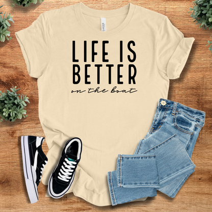 Heather-navy t-shirt with '' text, flat lay styled on a wooden surface.